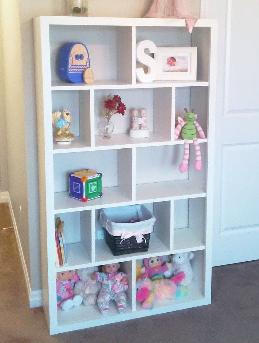 Tall white bookcase with a subway-tile grid of cubbies