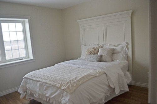Tall queen bed headboard with a plywood center panel framed in moulding