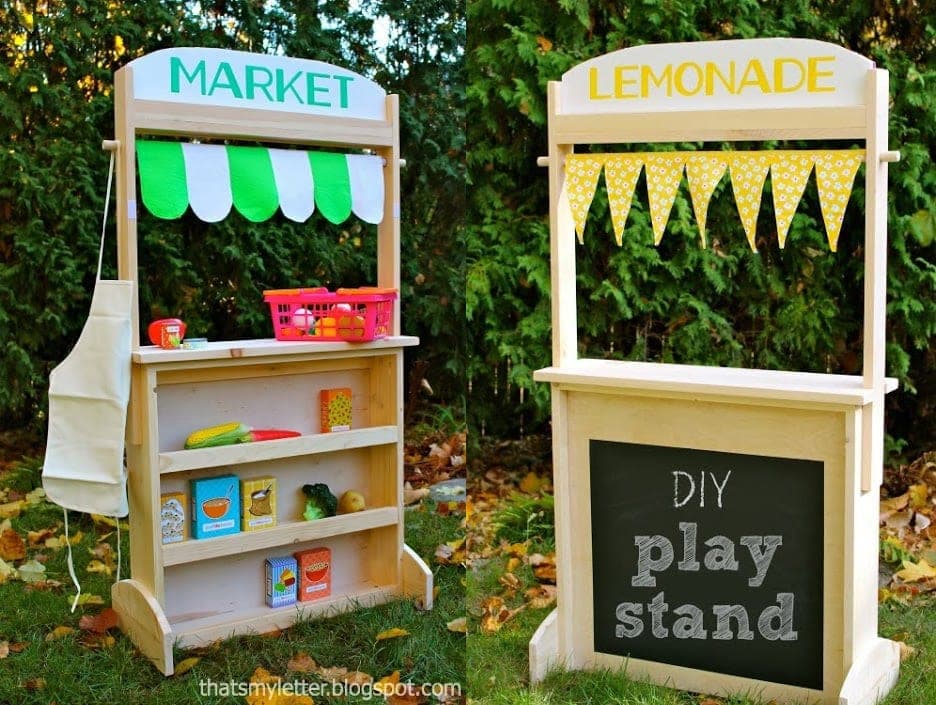 Wooden pretend-play store stand with chalkboard back and a sign hutch on top