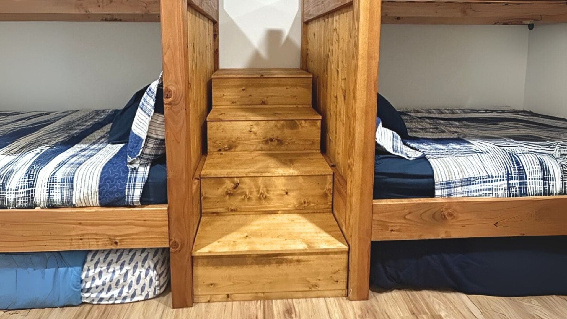 Wooden bunk bed staircase with storage drawers built into the risers