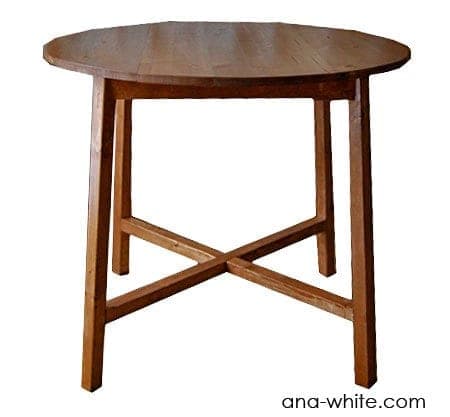 Round-top accent table on a splayed X-shaped base