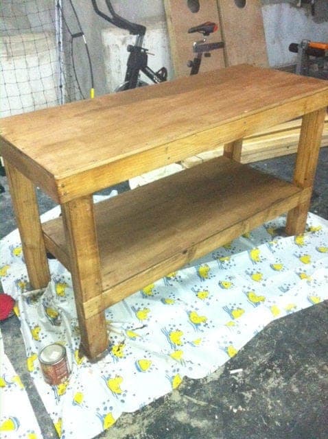 Simple 2x4 shop workbench with a lower plywood shelf