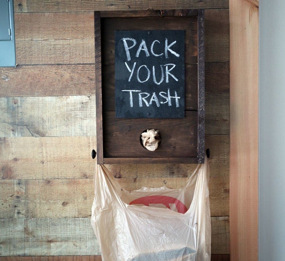 Wall-mounted wood box for dispensing plastic grocery bags