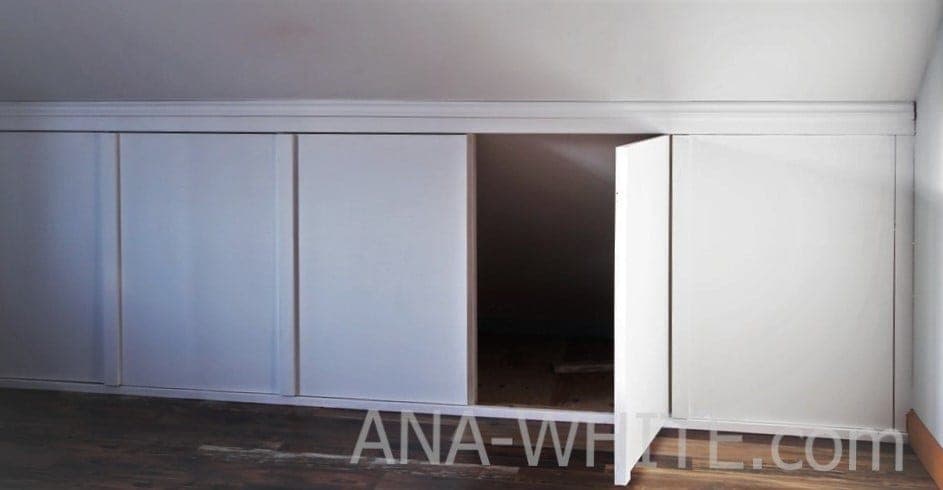 Attic knee wall with concealed storage doors styled as board-and-batten paneling