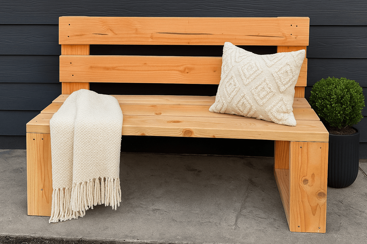 Minimal modern wood bench with low back built from five 2x6 boards