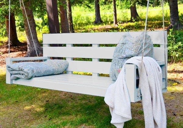Large modern hanging porch swing couch with flat slat arms and back