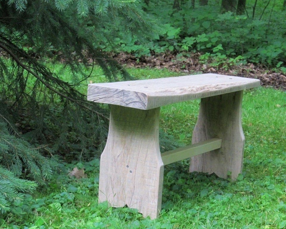 Small oak bench built from a single 2x10 board with tapered legs