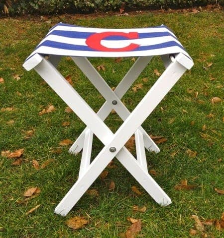 Folding wooden camp stool with a canvas sling seat