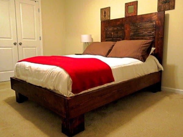 Full-size bed frame with a framed headboard and inset panel boards