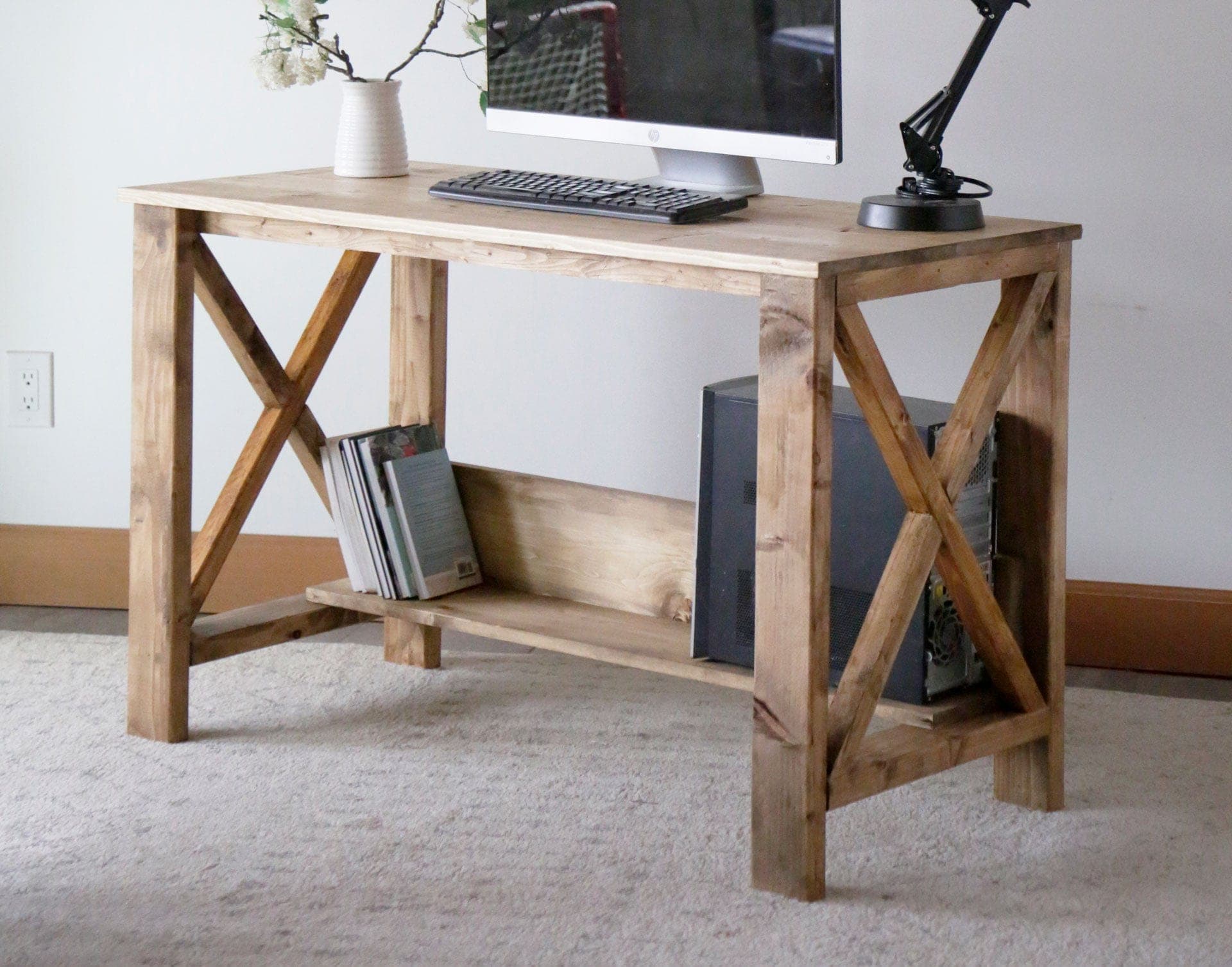 Farmhouse desk with X-braced legs and a planked top