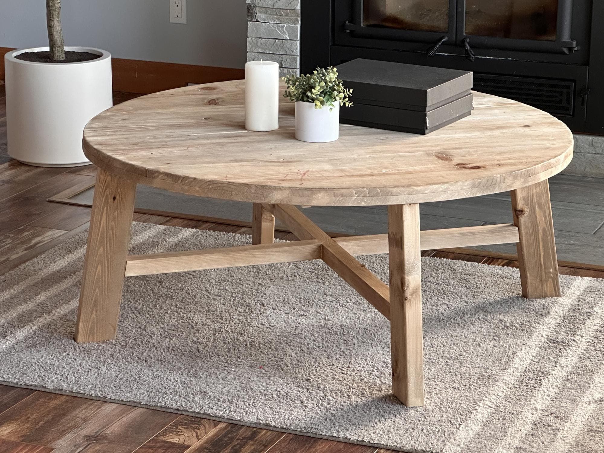 Large round-top farmhouse coffee table on a splayed pedestal base