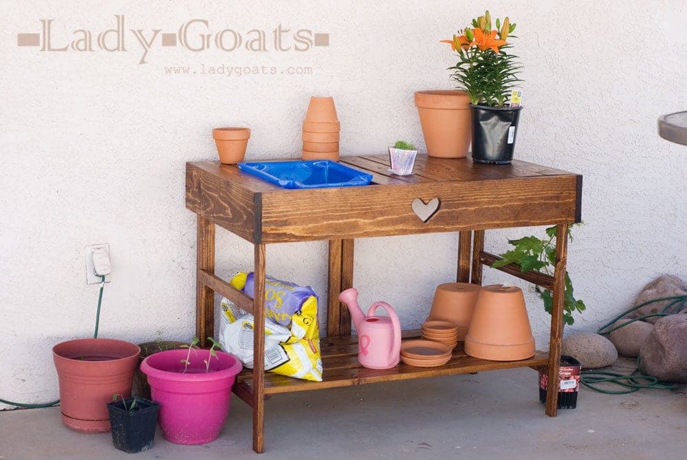 Folding wooden potting bench with a slatted top
