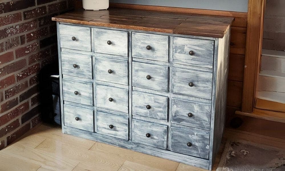 Console cabinet with doors faced to look like a grid of small apothecary drawers