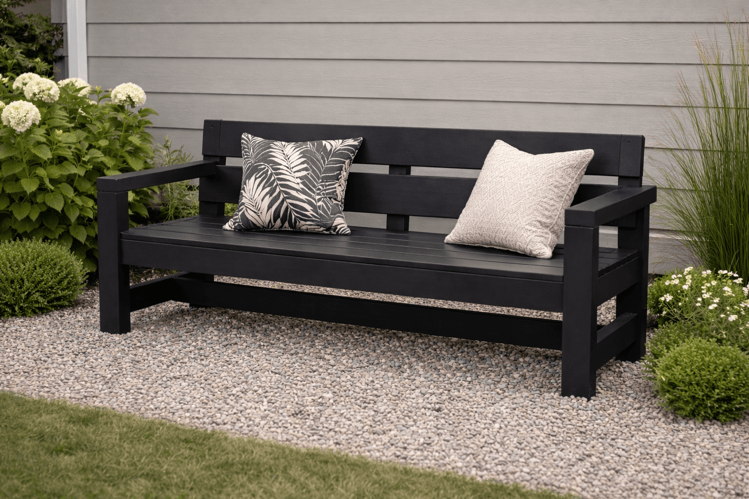 Six-foot modern wooden park bench with arms and slatted back