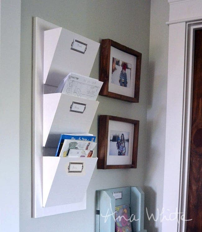 Wall-mounted mail sorter with three angled bins