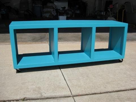 Low rolling bench with three open cubbies and casters