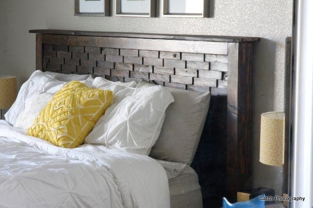 Queen bed with 4x4 legs and a headboard faced in patterned wood shims