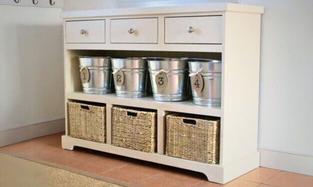 Entryway console with three drawers above open shelves