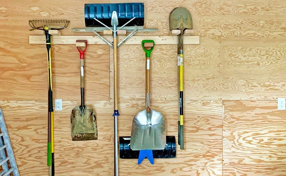 Wall-mounted garden tool storage rack
