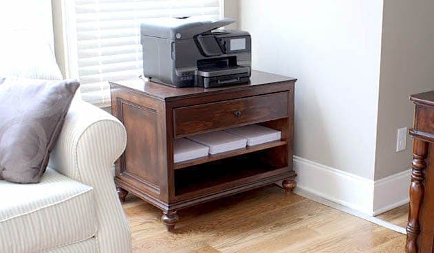 Refined printer cabinet with bun feet and a single drawer
