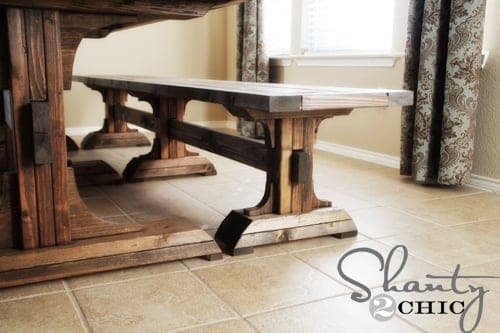 Long farmhouse dining bench on three pedestal bases