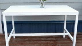 Compact slatted-top outdoor dining table for small spaces