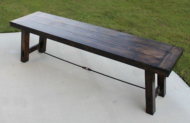 Industrial farmhouse trestle bench with an iron pipe stretcher