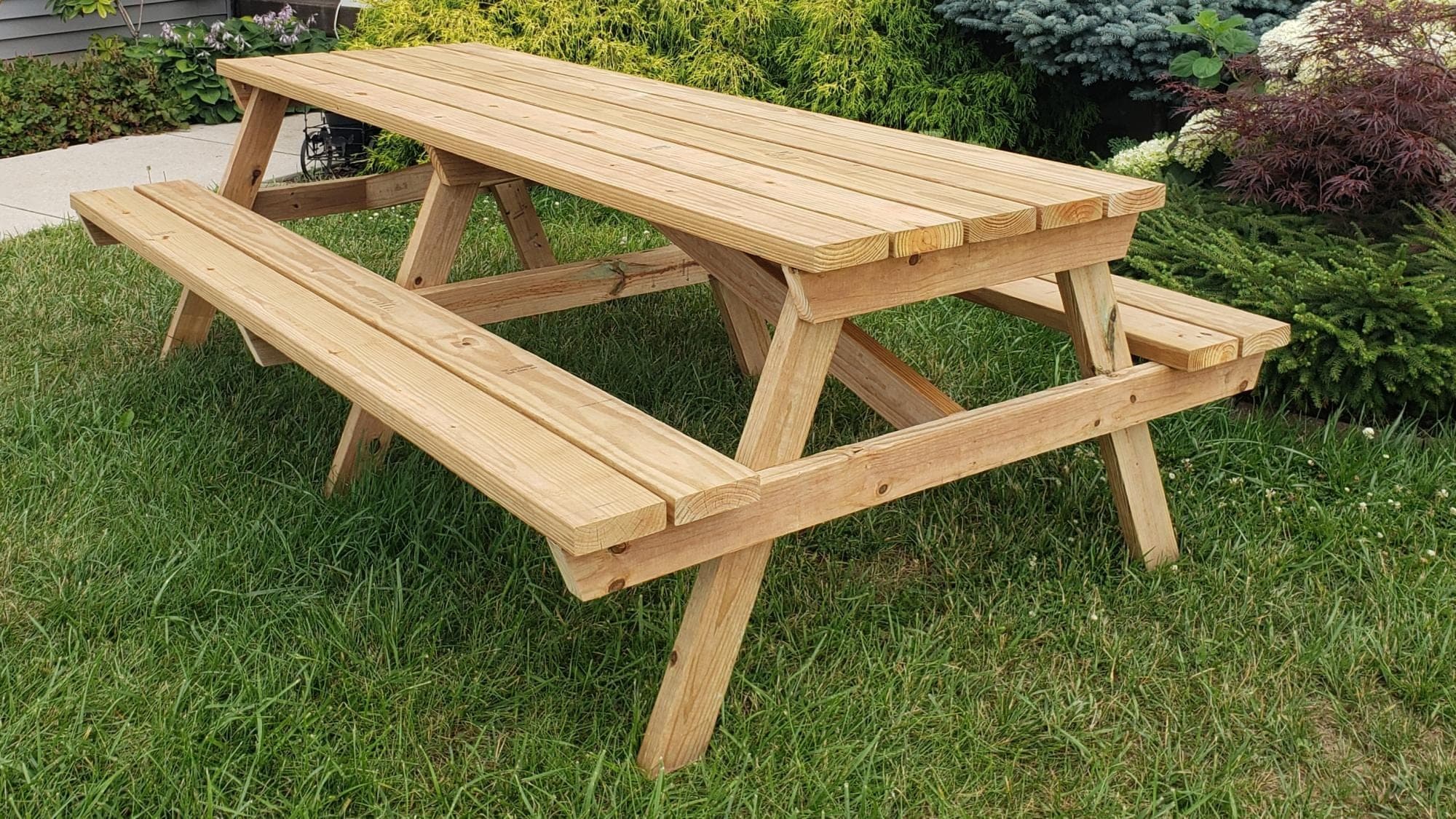 Eight-foot wooden picnic table with three A-frame leg sets