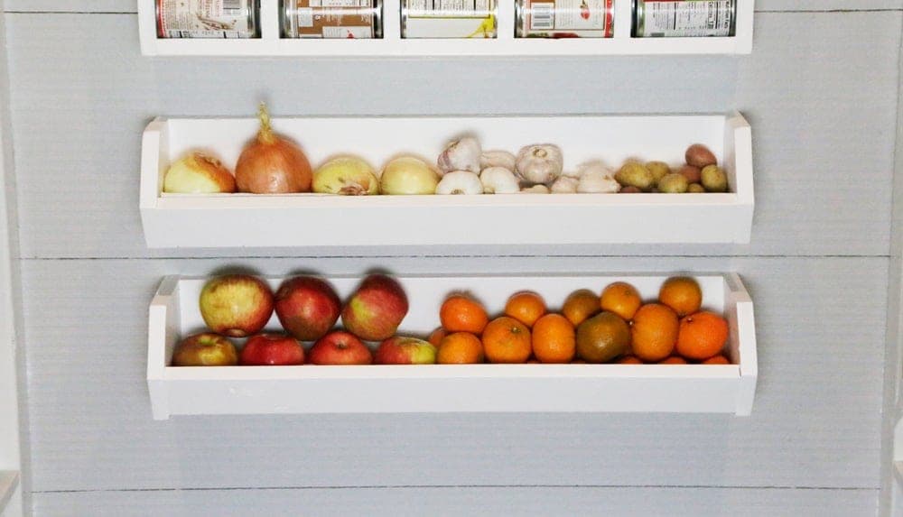 Wall-hung wooden produce bin shelf with angled sides