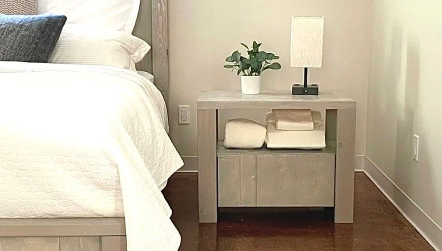 Farmhouse nightstand with a built-in angled finger-pull drawer