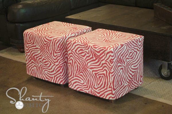 Small upholstered cube ottoman with a sewn slipcover