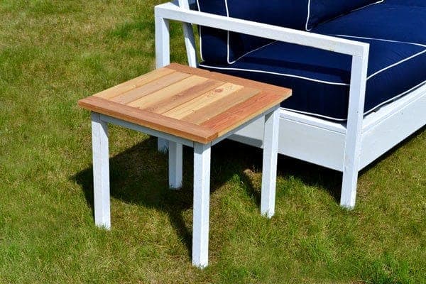 Small white outdoor end table with a slatted top