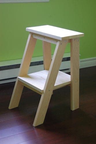 Small leaning ladder-style side table with two shelves and angled legs