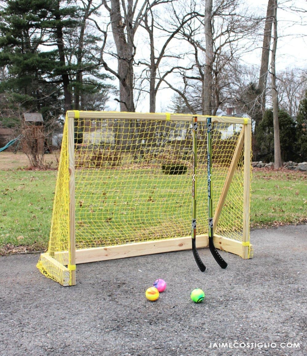 Wooden street hockey goal frame with a net