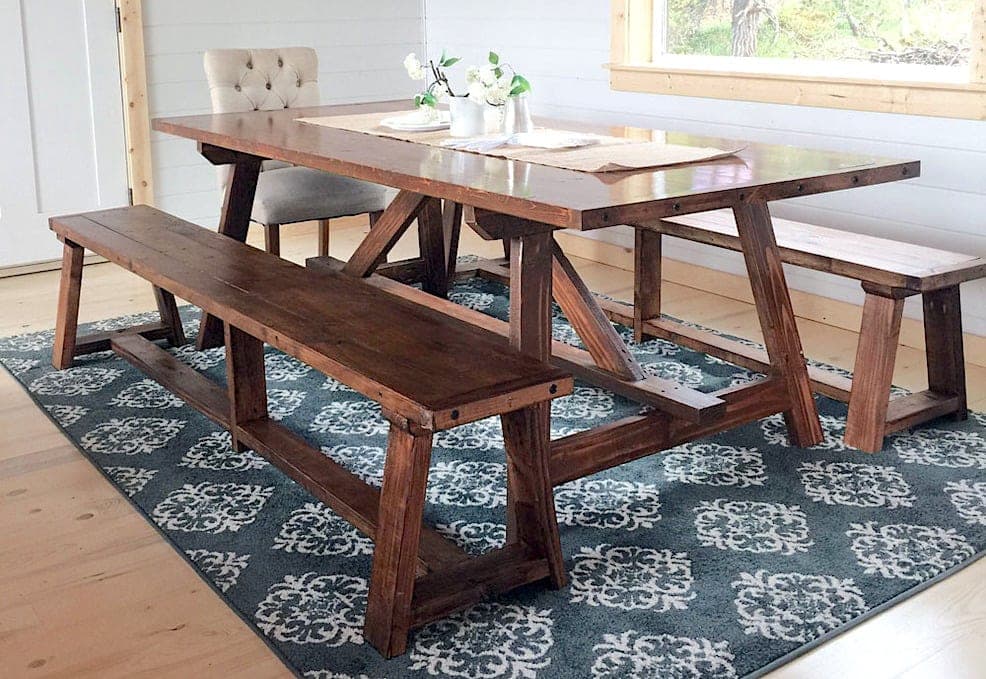 Trestle-style dining table with a 2x4 truss brace under a plank top