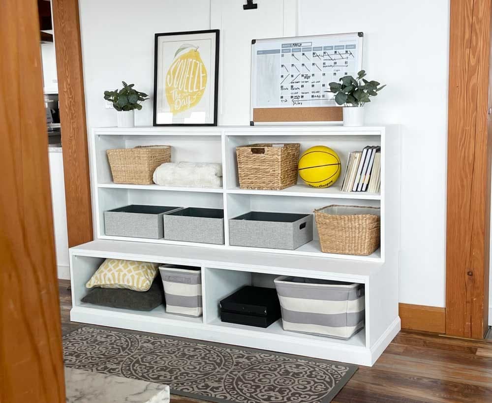 A frameless three-bay plywood bookshelf hutch with edge-banded shelves