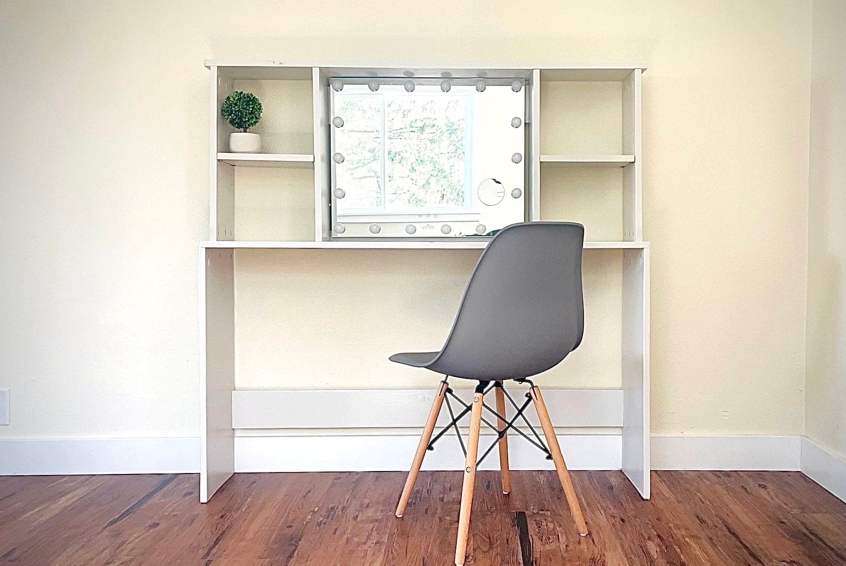 Vanity table with a shelf hutch for a light-up mirror