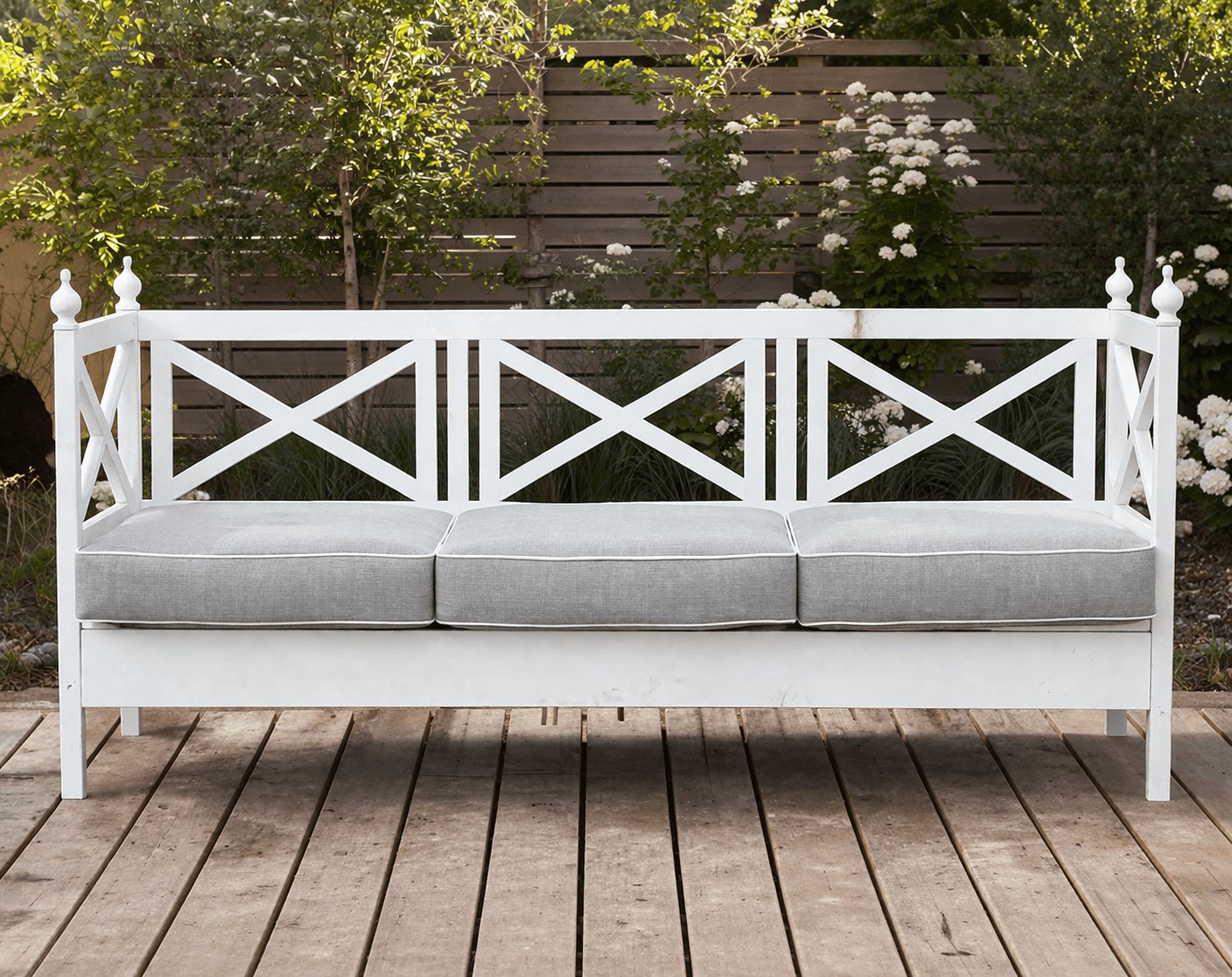An outdoor sofa with a back made of five mitered X panels