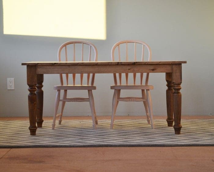 Kid-height farmhouse play table with turned legs and a plank-look top