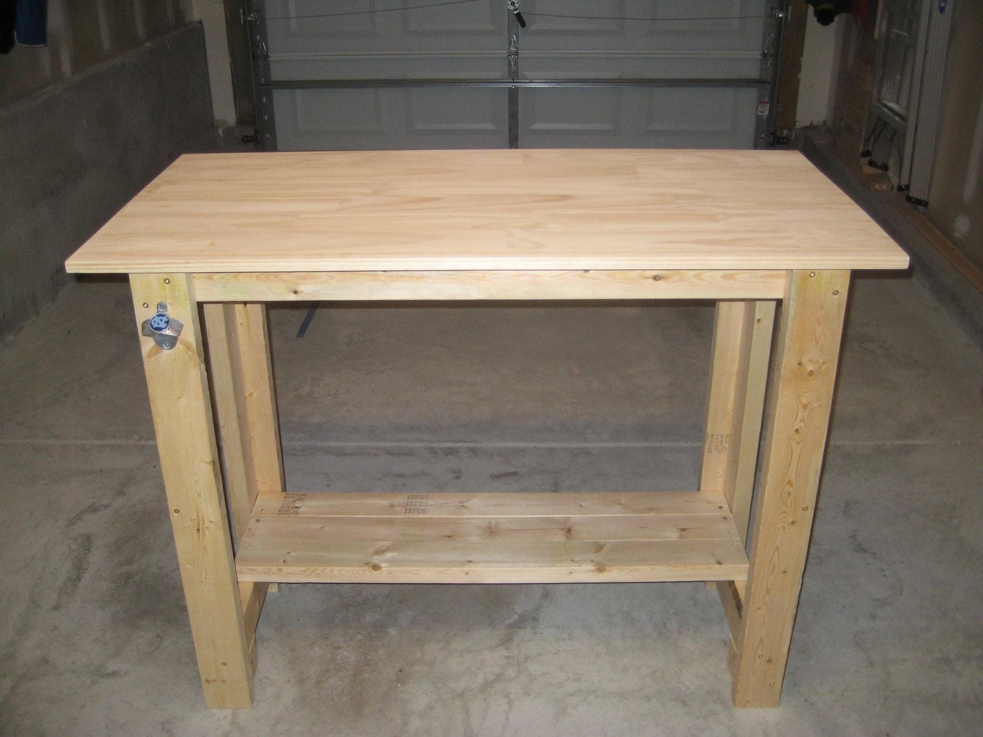 Simple sturdy workbench with L-shaped 2x4 legs and a laminated pine top