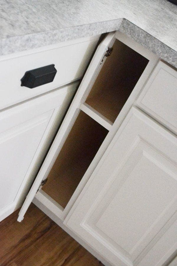 Narrow 6-inch filler base cabinet built into a fitted kitchen cabinet run