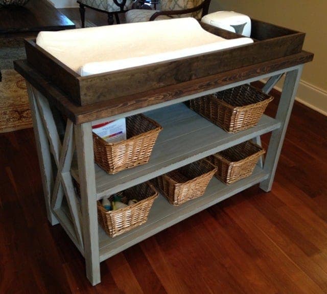 Rustic changing table with X-braced side frames and a low topper