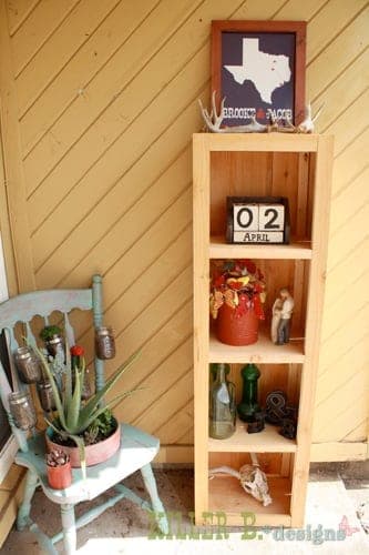 Rustic bookcase clad in weathered cedar fence pickets over a square pine frame