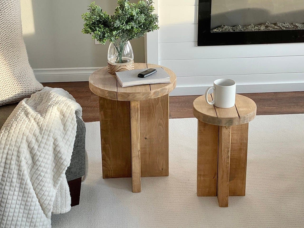 Round modern wood side table on interlocking X legs