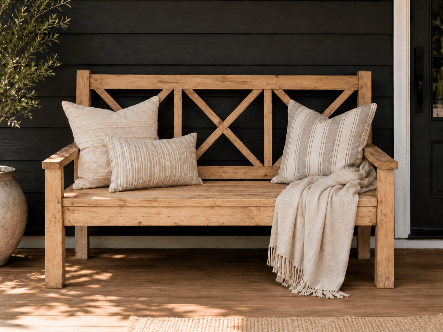Long outdoor bench with an X-lattice back panel