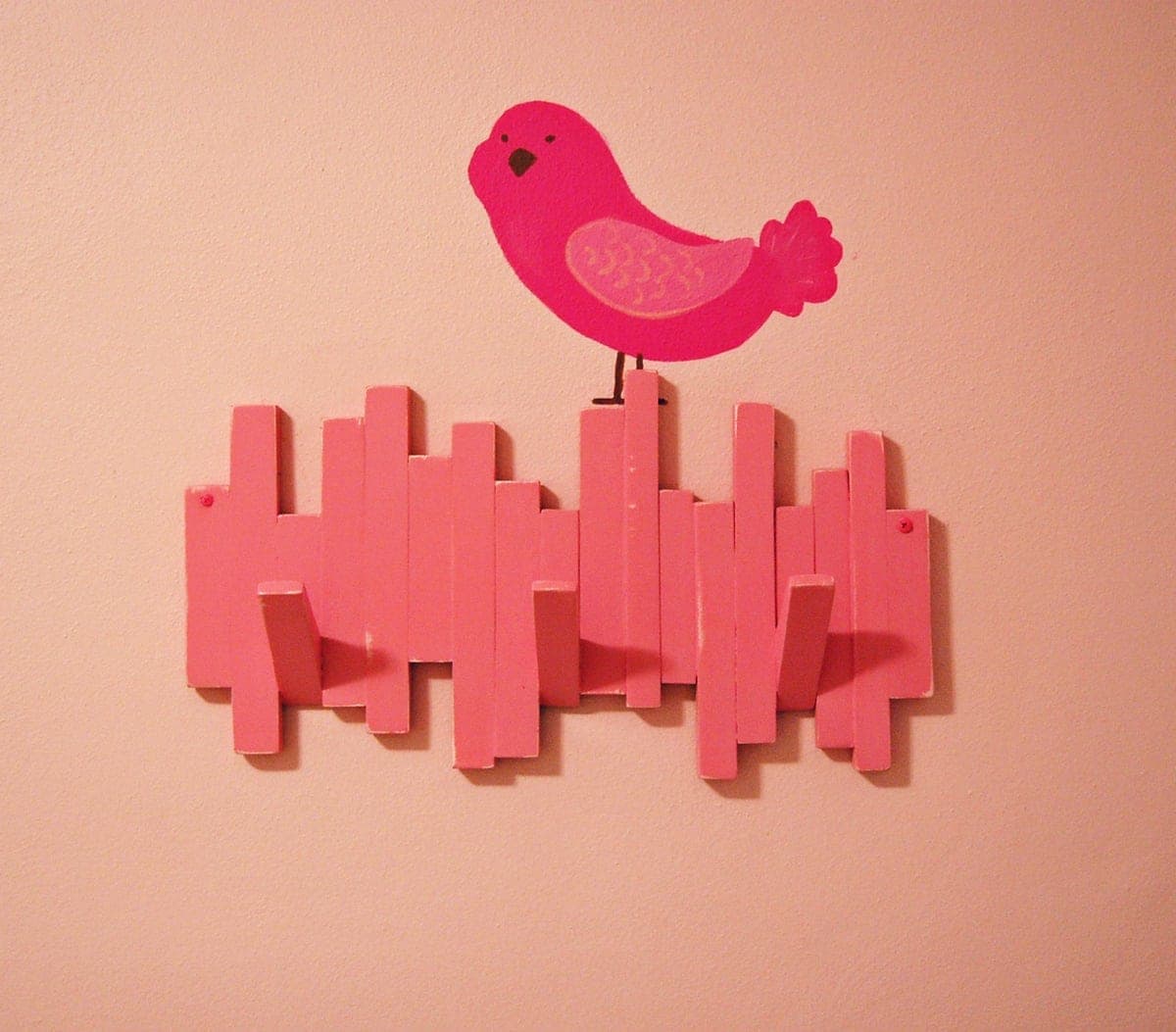 Wall-mounted coat rack built from scrap wood offcuts
