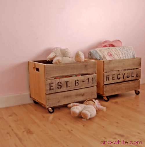 A rolling wood crate cart with slatted sides and cut handles