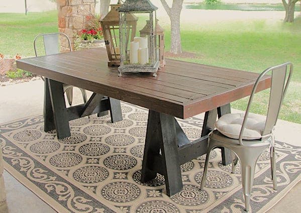 Outdoor dining table on angled sawhorse legs