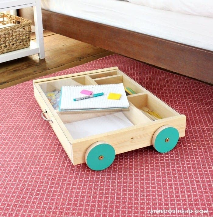Rolling underbed art cart with scrap wood wheels and acrylic top
