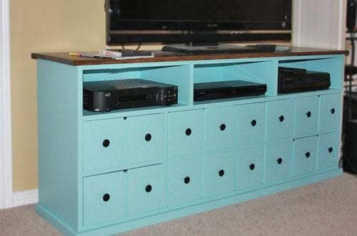 Media console with apothecary-style small drawer and door faces